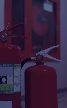 Red fire extinguishers in a manufacturing facility in Tronica City, Ghaziabad.