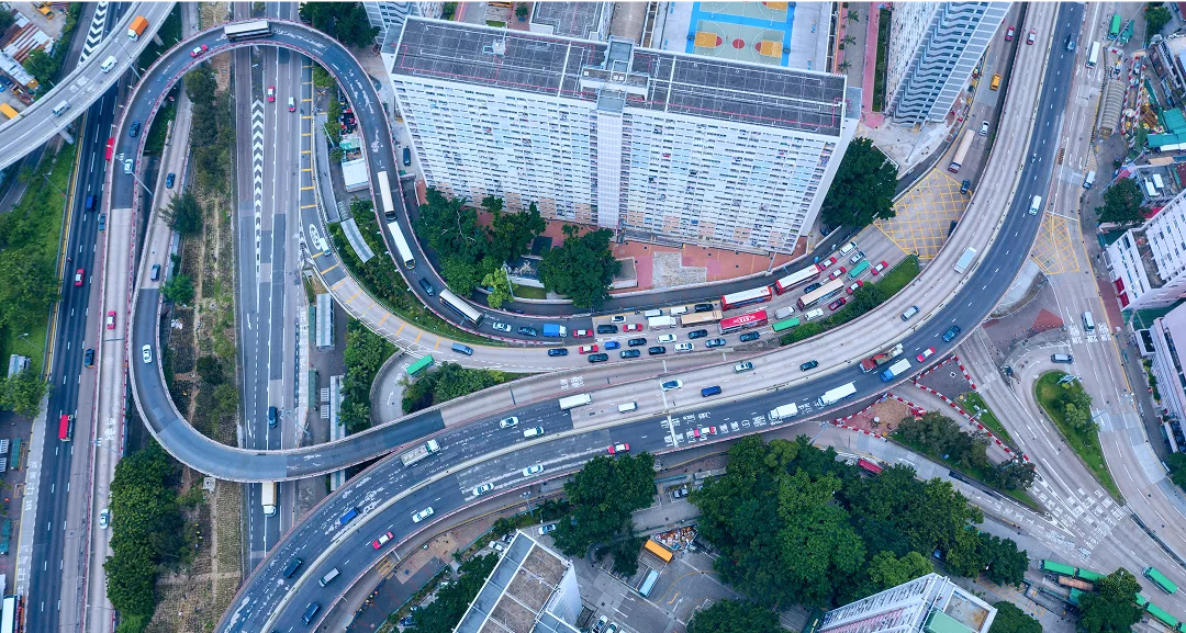 Aerial view of complex road interchange and highway infrastructure near manufacturing facility in Tronica City, Ghaziabad.