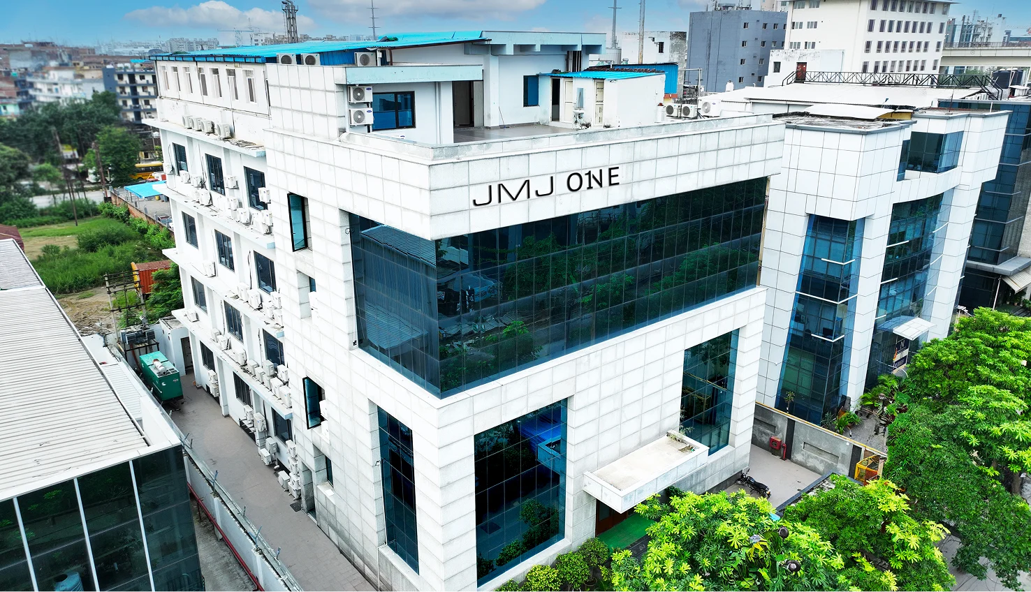 Side perspective of JMJ ONE modern workspace in Noida