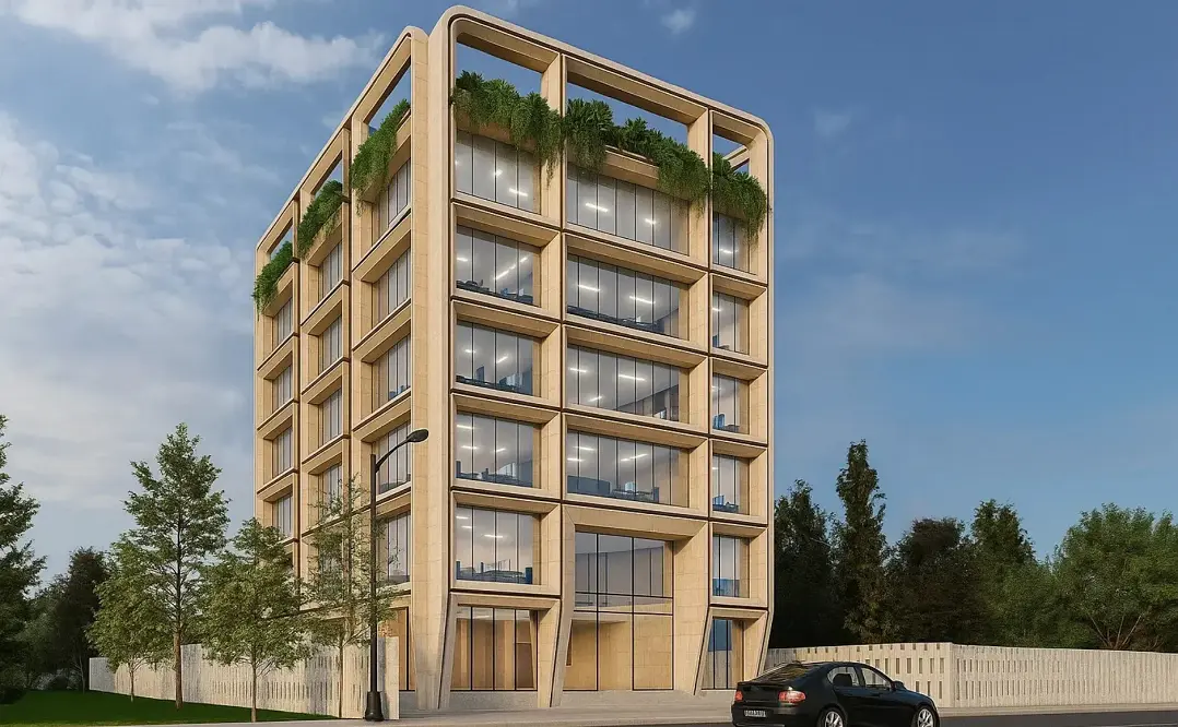 JMJ Estate modern commercial office building featuring a sustainable glass facade and rooftop greenery in India.